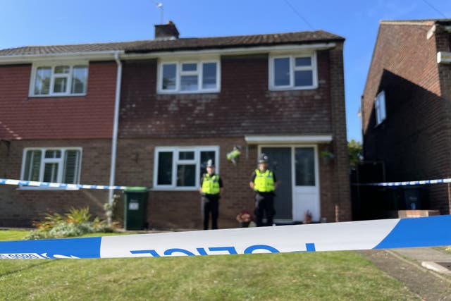 <p>Police officers at the scene in Lovett Avenue, Oldbury </p>